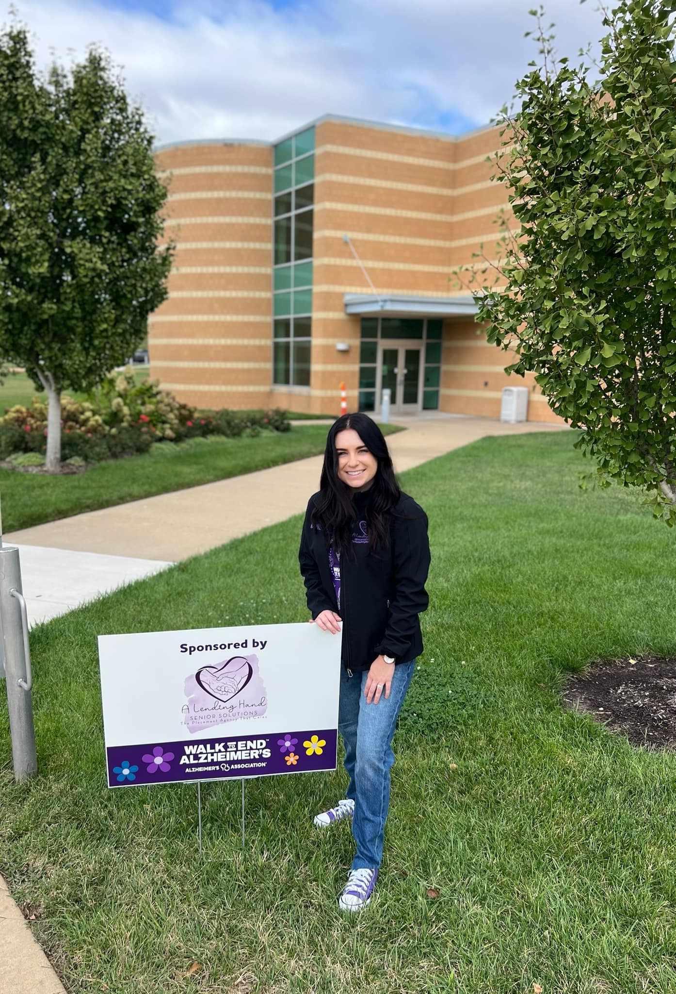 Brittney with Walk to End Alzheimer's sponsor sign